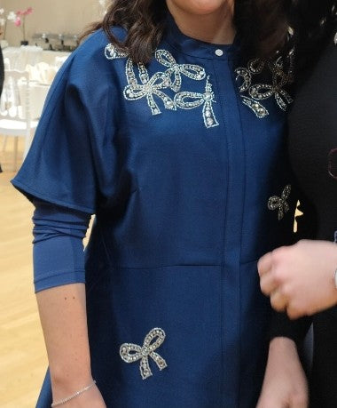 Blue satin gown with beaded bows